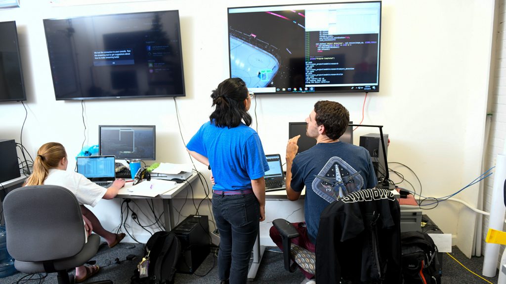 Students look at computer screens in a statistics lab