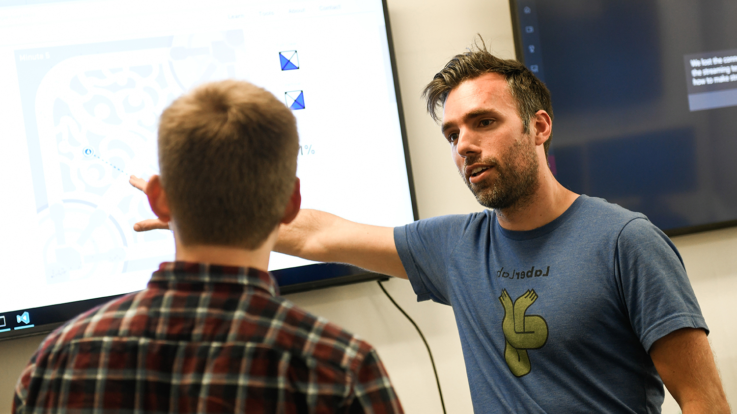 Eric Laber talks with a student